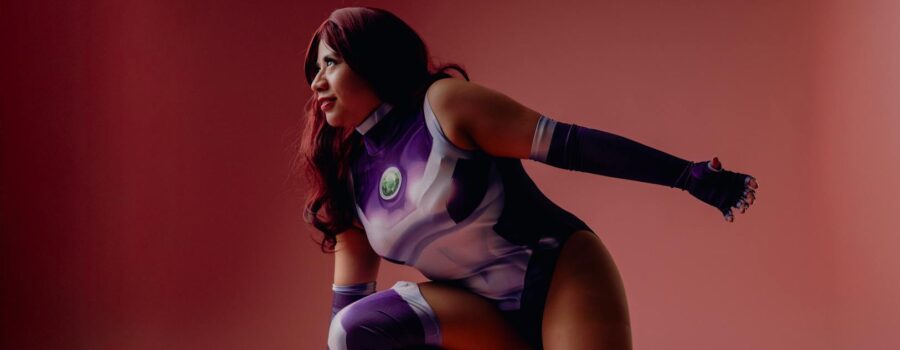dynamic cosplay portrait on pink backdrop