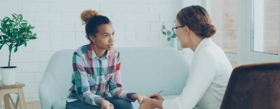 teen counseling session in modern office