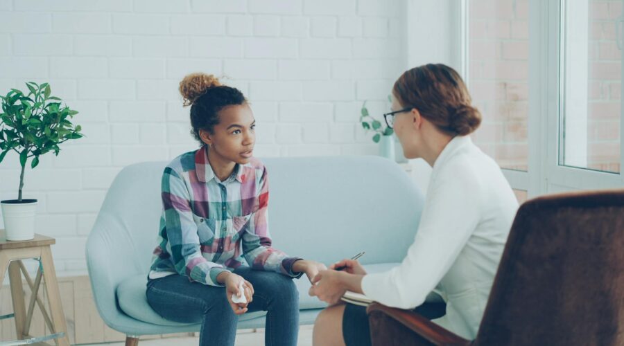 teen counseling session in modern office